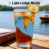 A tall glass of iced tea with a lemon slice sits on a wooden table, featuring a blue Lake Almanor graphic.