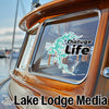 Chatuge Life sticker on a wooden boat window with "Lake Lodge Media" text.