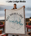 Man holding Bull Shoals Lake Arkansas map blanket with compass rose detail.