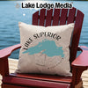 Pillow with Lake Superior map and compass design on a red Adirondack chair.