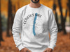White sweatshirt with Conesus Lake New York compass graphic and map detail.