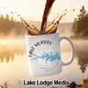 White mug with "Lake Murray South Carolina" compass design, coffee pouring.