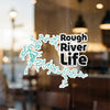 Rough River Life sticker with teal river outline on glass.