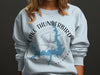 Light blue sweatshirt with Lake Thunderbird Oklahoma map and compass graphic.