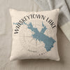 Cream pillow with blue Whiskeytown Lake map and compass graphic, and text.