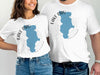 White t-shirts with blue Lake Piru map and compass design; "CALIFORNIA" text.