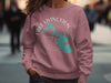 Pink crewneck sweatshirt with Lake Livingston Texas map and compass design.