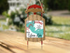 Rustic wooden sled ornament with "Merry Christmas from Sylvan Lake" text.