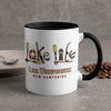 White mug with black rim and handle, featuring "Lake Winnipesaukee New Hampshire" text and lake life graphics.