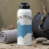 White water bottle with a blue Massachusetts shape and compass design.