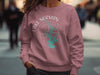 Rose sweatshirt with Lake Norman NC compass graphic and brand name.
