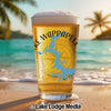 Beer glass with "Lake Wappapello" and Missouri outline on beach with palm trees.