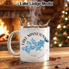 White mug with Lake Minnetonka map design and Lake Lodge Media logo.