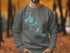 Grey sweatshirt with "Beautiful Madison Lakes Wisconsin" map design and compass.