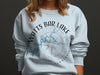 Light blue sweatshirt with "Watts Bar Lake Tennessee" and compass design.