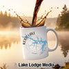 White mug with "Kerr Lake Virginia" compass design, coffee pouring.