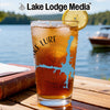 Glass of iced tea with a lemon slice, featuring a blue lake outline and compass design.