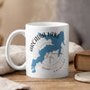 White mug with blue map of Arcadia Lake, Oklahoma, and compass rose graphic.