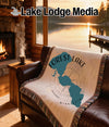 Woven blanket with Forest Lake, Minnesota map design on a leather couch.