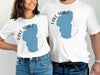 White t-shirts with blue Lake Tahoe map and compass graphic.