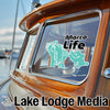 Teal "Marco Life" sticker on a boat window, with "Lake Lodge Media" below.