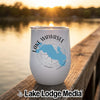 A white stainless steel wine tumbler with Lake Wawasee map graphic sits on a wooden dock.