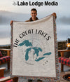Man holding a woven blanket with the Great Lakes map and "USA" text.