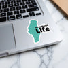 Winnebago Life sticker on a laptop keyboard with Lake Lodge Media LLC copyright.