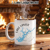 White mug with Lake Lanier map and compass, steaming coffee splashing.