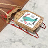Sled ornament with "Merry Christmas From Pyramid Lake" text and a teal map outline.