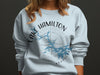 Light blue sweatshirt with Lake Hamilton Arkansas compass design