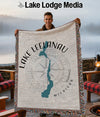 Woven throw blanket with Lake Leelanau map and compass design.