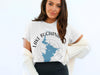 White t-shirt featuring a blue Lake Buchanan map with compass rose and "Texas" text.