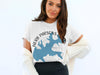 White t-shirt with blue Tennessee state outline graphic and text.