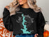 Black sweatshirt with "Beautiful Eagle Mountain Lake Texas" design.