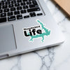 Sticker with "Thunderbird Life" text and lake shape on a laptop.