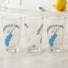 Three clear glasses featuring a blue Saratoga Lake map and compass design.