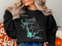 Black sweatshirt with Lake Oroville California compass design.