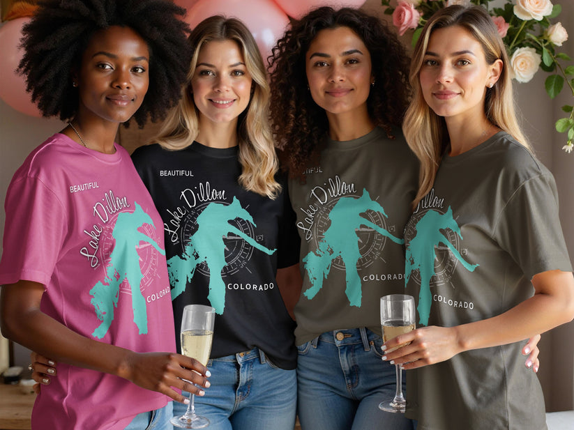 Four women wearing graphic t-shirts with a Lake Dillon, Colorado compass design.