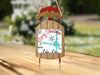 Sled ornament with "Merry Christmas From Lake Lure" text and snowflakes.
