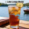 Glass of iced tea with lemon, featuring a compass rose and lake map design.