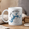White mug with Lake Monroe, Indiana map and compass design.