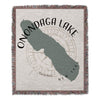 Woven blanket featuring Onondaga Lake outline over compass and text.