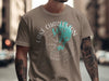 T-shirt with Lake Charleston outline map, compass, and text in white and turquoise.