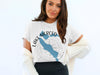 White t-shirt with blue Lake Merced California map and compass graphic.