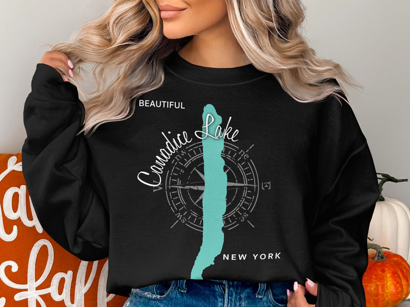 Black sweatshirt with "Beautiful Canidice Lake New York" and compass graphic.