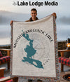 Man holding Moose lookmeguntic Lake Maine map throw blanket with compass design.