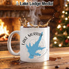 White mug with Lake Murray California design and splashing coffee.