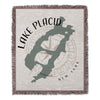 Lake Placid map with compass and "New York" text on a woven blanket.
