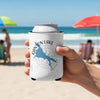 White can cooler with Canyon Lake Arizona map and compass design held on beach.